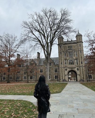 Agomjot views the historic law building on Michigan's campus during her campus tour.